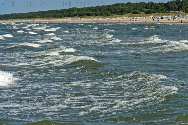 Play of Baltic Sea waves on the beach of the seaside resort of Ahlbeck, Usedom island, Mecklenburg-Western Pomerania, Germany