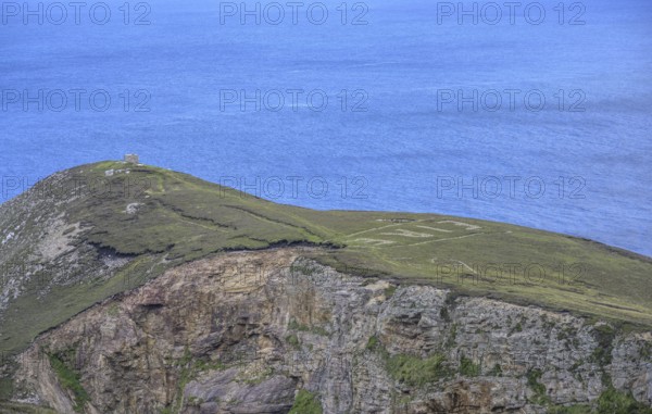 Eire sign from World War II, Portacloy loop cliff walk, Muingnabo, County Mayo, Ireland