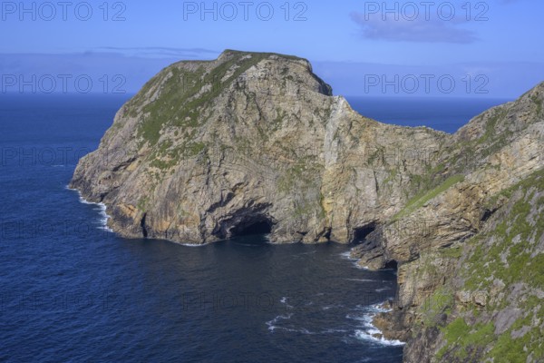 View of blue sea and cliffs with rock gate from Portacloy Loop Cliff Walk, Muingnabo, County Mayo, Ireland