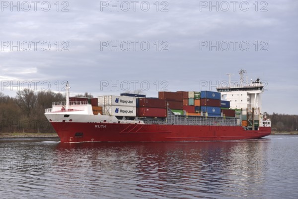 Container ship, RUTH sails in the evening in the Kiel Canal, NOK, Kiel Canal, Kiel Canal, Schleswig-Holstein, Germany