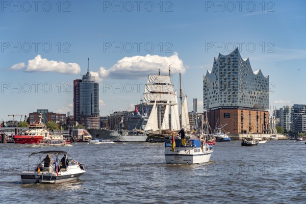 Incoming parade of ships and sailboats at Hafengeburtstag Hamburg 2025 in front of the Elbe Philharmonic Hall in the Hanseatic City of Hamburg, Germany