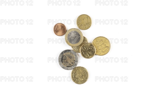 Different euro coins of different denominations on a white background