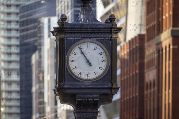 Toronto Union Station clock in front of Union Station, main city passenger transportation hub that services intercity and international connections