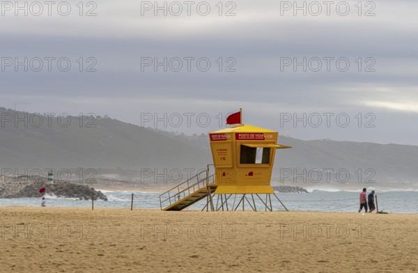 Yellow lifeguard surveillance container on Nazare beach, Portugal