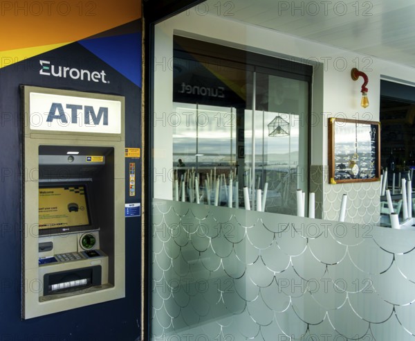 ATM cash machine next to a restaurant, Nazare, Portugal
