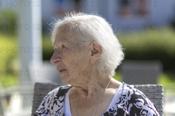 Thoughtful 86-year-old woman, retirement home, Jettingen, Baden-WÃ¼rttemberg, Germany