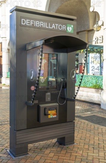 JCDecaux modern public access defibrillator station kiosk communication hub, town centre of Ipswich, Suffolk, England, UK