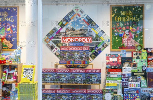 Monopoly and other board games in window display of Waterstones bookshop, Ipswich, Suffolk, England, UK