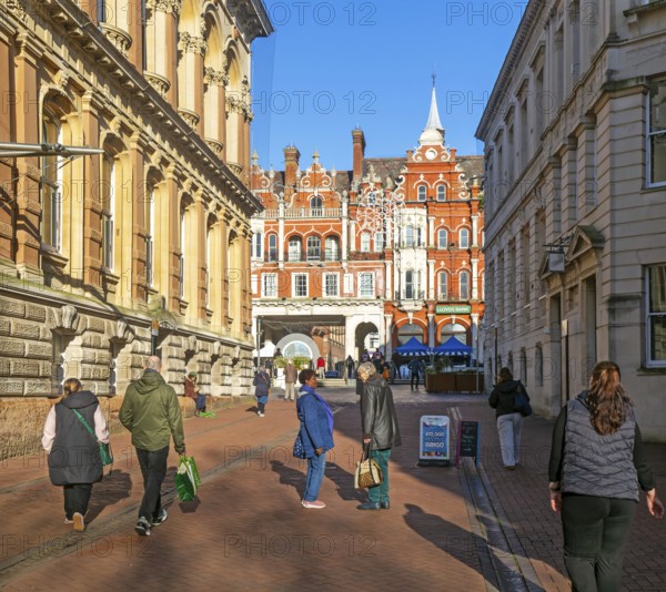 People walking chatting in pedestrianised area, Princes street, town centre of Ipswich, Suffolk, England, UK