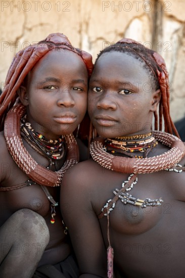 Group of Himba people, Himba woman, traditional Himba village, Kaokoveld, Kunene, Namibia