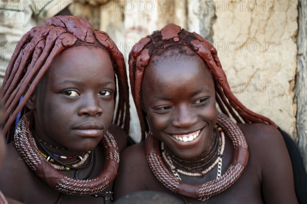 Himba woman laughing, traditional Himba village, Kaokoveld, Kunene, Namibia