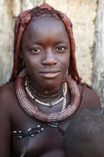 Himba woman smiling, traditional Himba village, Kaokoveld, Kunene, Namibia