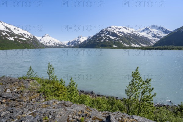 View of mountains with Portage Glacier glacier and turquoise glacial lake Portage Lake, Chugach National Forest, Alaska, USA