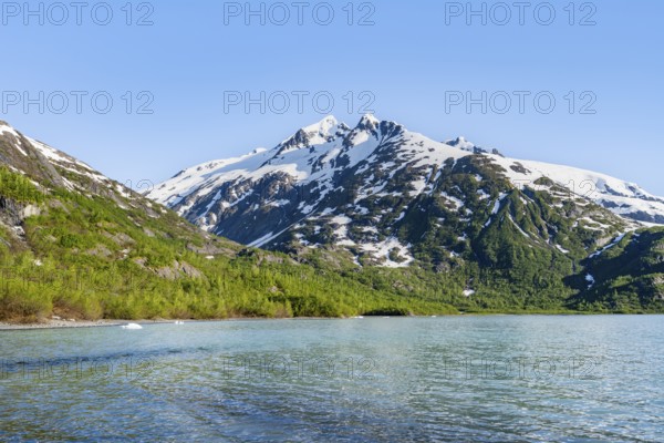 Snowy mountains on glacial lake Portage Lake, Chugach National Forest, Alaska, USA