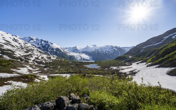 View from Portage Pass of Divide Lake, snowy mountain peaks and glaciers Portage Glacier, Portage Pass Trail, near Whittier, Alaska, USA