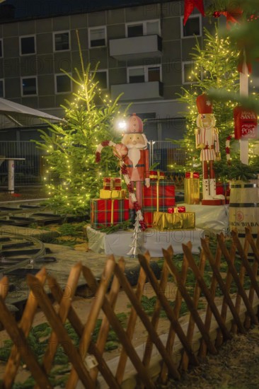 Christmas decorations with gifts and fir trees, illuminated with festive lights, Sindelfingen, Böblingen district, Germany