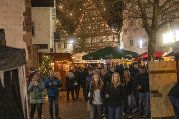 Lively Christmas market with numerous visitors and illuminated half-timbered houses, Christmas market 2025, Nagold, Black Forest, Calw district, Germany