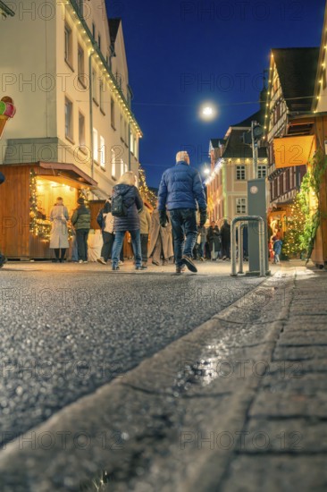 Christmas street at night with people and festive lighting, Christmas market 2025, Nagold, Black Forest, Calw district, Germany