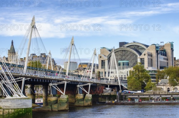 The Hungerford Bridge and Golden Jubilee Bridge across the Thames with Embankment Place, City of Westminster, London, Great Britain