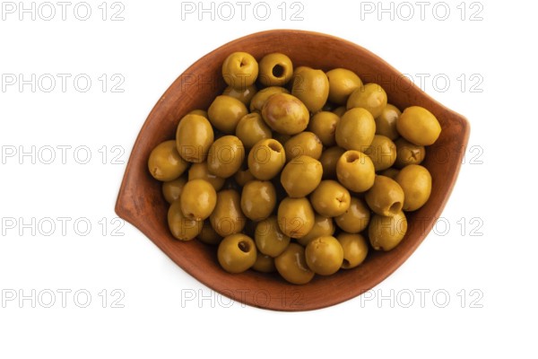 Fresh green olives in ceramic clay isolated on white background. Top view, flat lay, close up