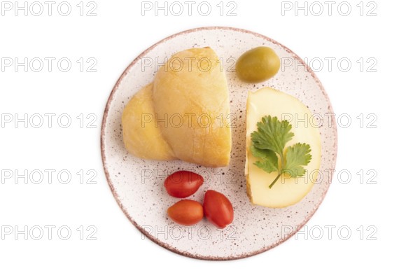 Smoked Mozzarella cheese, with tomatoes and olives isolated on white background, top view, flat lay, copy space