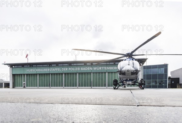 Helicopter from the Baden-WÃ¼rttemberg Police team in front of the hangar at the airport. Airbus Helicopters H145. Stuttgart, Baden-WÃ¼rttemberg, Germany
