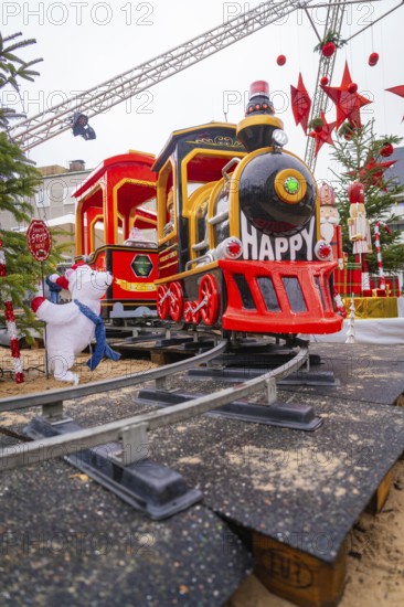 Close-up view of a cheerful toy locomotive at a Christmas market, Sindelfingen, Böblingen district, Germany