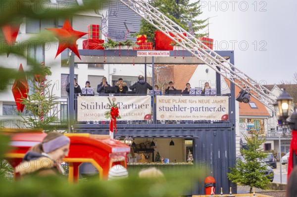 Stage with musicians and Christmas decorations at a festive Christmas market, Sindelfingen, Böblingen district, Germany