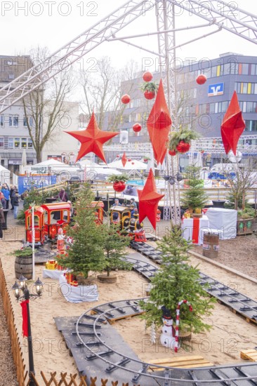 A festively decorated Christmas market with trees, trains and big red stars, Sindelfingen, Böblingen district, Germany