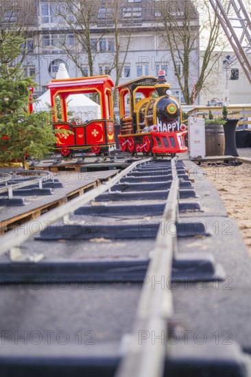 A toy train on rails in a Christmas setting with festive colors, Sindelfingen, Böblingen district, Germany
