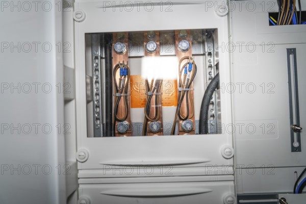 Close-up of a control box with detailed wiring and copper elements, electrician, new building, Germany
