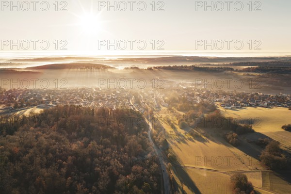 Aerial view of a village and landscape with rising sun and fog, Gechingen, Hecken and GÃ¤u region, Calw district, Germany