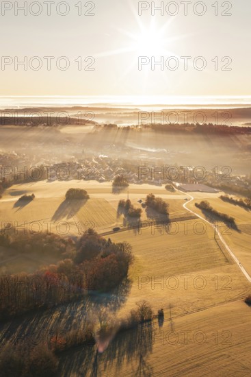 The landscape is bathed in golden light, with distant views of fields and forests, Gechingen, Hecken and GÃ¤u region, Calw district, Germany