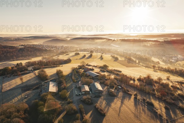 Aerial view of fields and hills at sunrise with light fog, Gechingen, Hecken and GÃ¤u region, Calw district, Germany