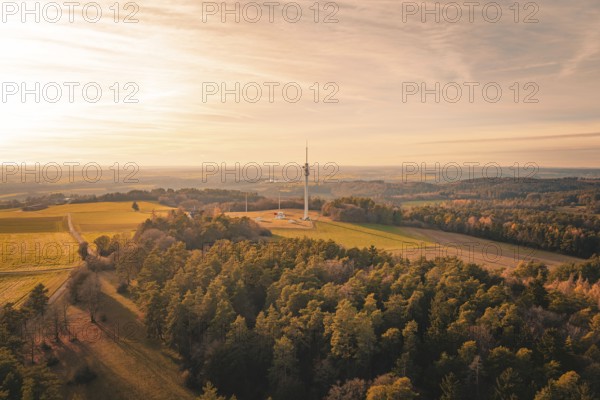 Radio tower in the middle of a vast landscape surrounded by forests in soft evening light, Gechingen, Hecken and GÃ¤u region, Calw district, Germany