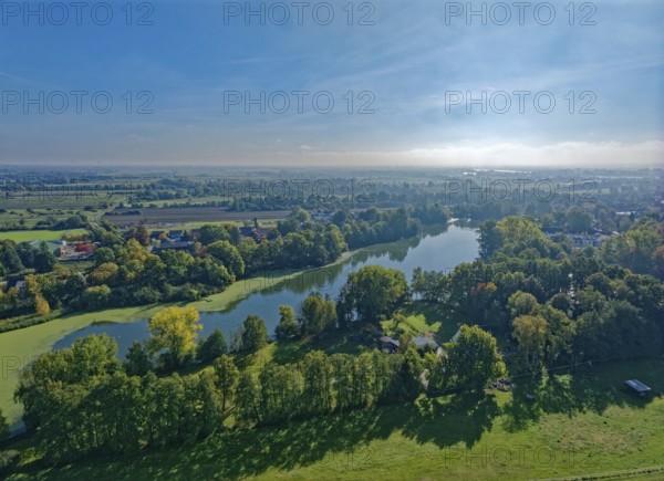 The sandback lake in Hamburg's Vier- und Marschlanden in autumn. aerial view. FÃ¼nfhausen, Kirchwerder, Hamburg, Germany