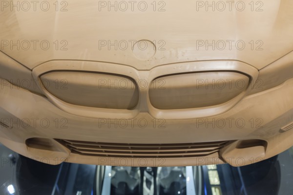 Clay model, clay model of a BMW vehicle used during the design process. These life-size models are an essential part of vehicle development at BMW to evaluate surfaces, lines and proportions in three dimensions, BMW Welt Munich, Bavaria, Germany