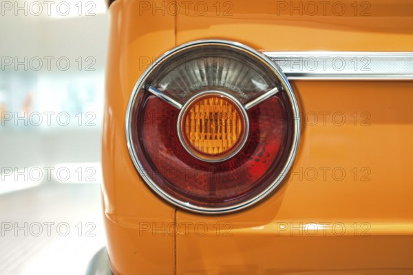 Detailed view, rear light of a BMW 2002 tii, BMW E10 series, also known as BMW 02 series. The round shape was a distinctive design feature of these models, which were manufactured in the 1960s and 1970s, BMW Welt Munich, Bavaria, Germany
