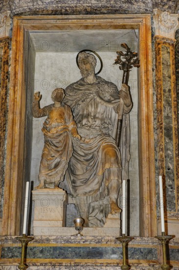 Statue sculpture of Iesu Infant Jesus and Saint Joseph S. Iosep with halo by Vincenzo De Rossi in San Giuseppe da Terrasanta chapel in ancient Roman temple Pantheon di of Agripppa, Catholic church Basilica of Santa Maria ad Martyres since 609 AD, Rome, Lazio, Italy