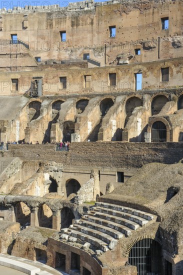 Restored historic grandstand seating marble seats near east entrance to the Colosseum, Rome, Lazium, Italy