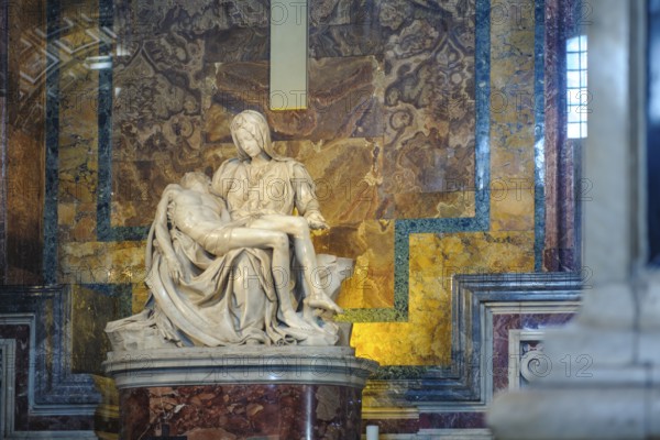 Front view of marble sculpture White marble sculpture from Carrara Pieta by Michelangelo Mary Mother of God mourning son, St. Peter's Basilica, Vatican City, Vatican, Rome, Italy