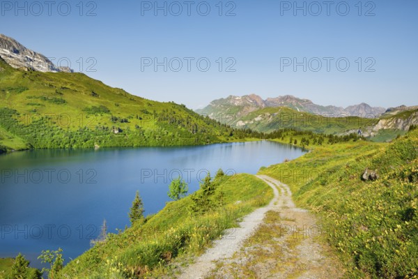 Hiking trail along Lake Engstlensee, Engstlenalp, Canton of Bern, Switzerland