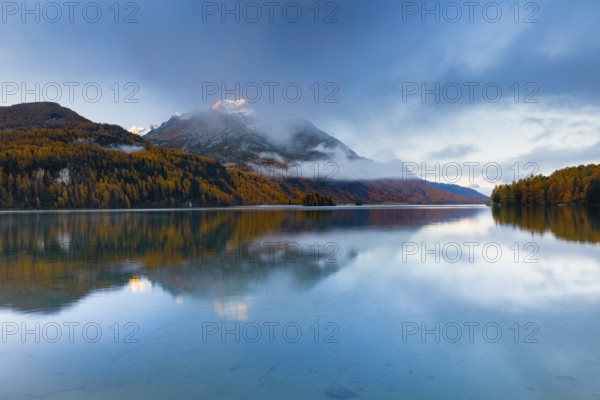 Clouds of fog over Lake Sils with Piz da la Margna in the background, Upper Engadin, Canton of GraubÃ¼nden, Switzerland