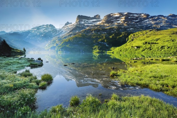 Engstlensee near Engstlenalp with GroÃŸ Wendenstock, Reissend Nollen and Titlis in the background, Canton of Bern, Switzerland