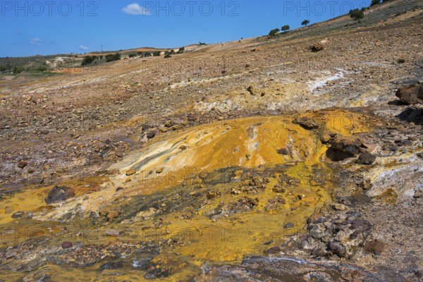 Area with yellow and brown rock formations under blue sky, geothermal area, rainbow rocks Tuzla, AyvacÄ±k, Ayvacik, Ã‡anakkale, Canakkale, Turkey