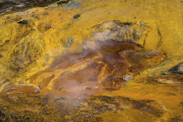 Geological landscape with smoking, mineral-rich surfaces in shades of yellow and orange, geothermal area, rainbow rocks Tuzla, AyvacÄ±k, Ayvacik, Ã‡anakkale, Canakkale, Turkey