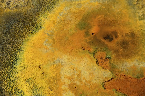 Detailed view of a mineral-rich volcanic landscape in intense shades of orange, geothermal area, rainbow rocks Tuzla, AyvacÄ±k, Ayvacik, Ã‡anakkale, Canakkale, Turkey