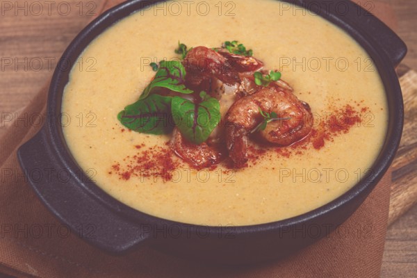 Pumpkin cream soup with shrimp, herbs and spices, homemade, no people