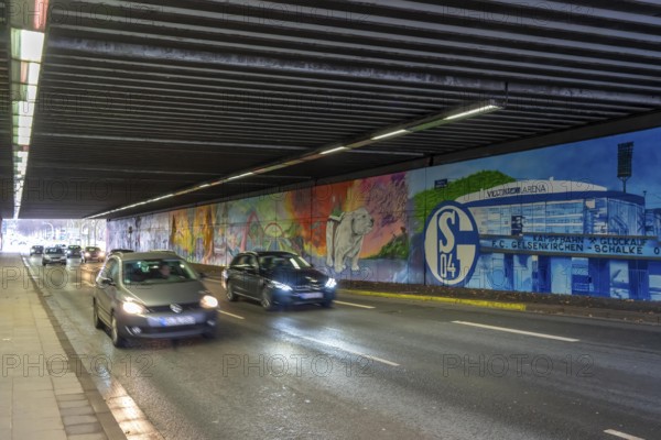 Huge street art pictures in a road tunnel in Gelsenkirchen, the approximately 120 meter long railway underpass of WickingstraÃŸe was extensively painted and sprayed on both sides by 11 Gelsenkirchen graffiti artists and collectives, over a total length of 174 meters, the wall paintings showed motifs from Gelsenkirchen history, from economy, coal, steel, soccer, Schalke 04, culture, life, to the 150.year-old city Anniversary on 29.11.25, North Rhine-Westphalia, Germany