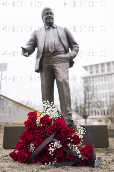 Red roses with a mourning ribbon lie in front of the Walter LÃ¼bcke memorial during the construction of Walter LÃ¼bcke Platz in front of the Konrad Adenauer Haus, the party headquarters of the Christian Democratic Union (CDU) on 2 December 2025. The square was built by the Centre for Political Beauty (ZPS) and approved by the Berlin Mitte district authority for two years. Walter LÃ¼bcke was a member of the Hessian state parliament for the CDU and was murdered by an AfD supporter on 2 June 2019